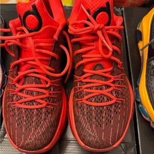 Nike Red and Black Athletic Shoes with Bold Design